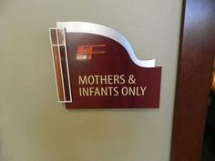 there is a sign on the wall that says mothers and infants only