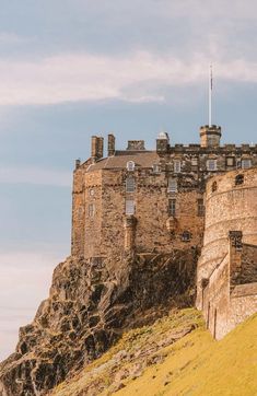 an old castle sitting on top of a hill