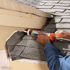 a man is using a hammer to repair the roof