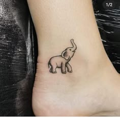 small elephant tattoo on the ankle