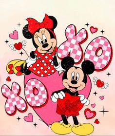 the mickey and minnie mouse are holding hearts