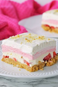 a piece of cake sitting on top of a white plate next to a pink towel