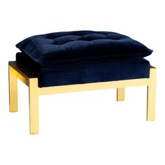 a blue velvet ottoman with gold legs and footstool in front of a white background