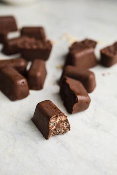 pieces of chocolate sitting on top of a counter