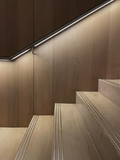 Design Museum showing Hidden LED lights under banister against wooden fit-out Stairs Hidden Light, Handrail Led Lighting, Illuminated Stairs, Flat Wood Handrail Lights, School Stairs, Timber Staircase Detail Drawing