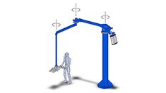 a person standing next to a blue pole with two lights on it and a cage hanging from the ceiling