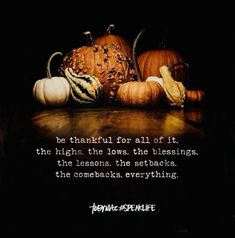 a bunch of pumpkins sitting on top of a table with a quote about thanksgiving