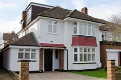 a large white house with a red roof