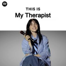 a woman sitting on the ground with a microphone in her hand and text that reads, this is my therapist