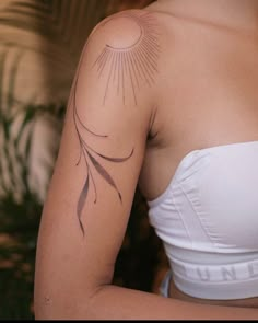 a woman with a tattoo on her arm