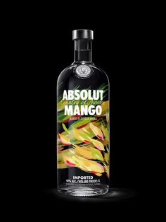 a bottle of absolut mango on a black background