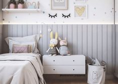 a child's bedroom decorated in pastel colors