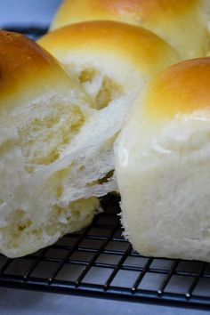 several pieces of bread sitting on top of a cooling rack