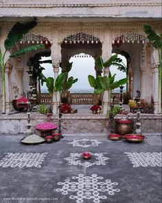 an outdoor area with potted plants and decorations