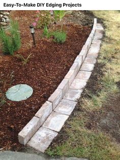 an easy to make diy edging project in the garden with bricks and mulch