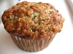 a muffin sitting on top of a white plate