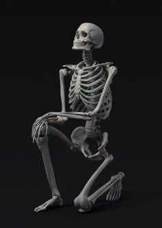 a skeleton is standing in the dark with one foot on his hip and another leg behind him