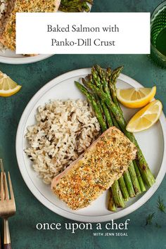 baked salmon with panko - dill crust served on a plate with asparagus and lemon wedges