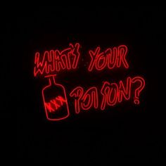 a neon sign that says what's your patron? in red on a black background