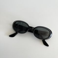 These round oval sunglasses are your everyday classic frames.  Featuring a brown tortoise frame with black lens.  This style is unisex.  True genuine vintage sunglasses from the 90s.   - 400 uv  - new vintage from the 90s Measurements:  Lens Height: 32mm  Lens Width: 50mm  Bridge:  17mm  Arm temple: 140mm Frame width: 133mm Also available in brown tortoise  Frame material: polyurethane  Lens material: glass Includes sunglasses pouch 90 Sunglasses, Black Oval Sunglasses, Sunglasses Pouch, Style Upgrade, Funky Jewelry, Girls With Glasses, Oval Sunglasses, Perfect Wardrobe, Classic Frame