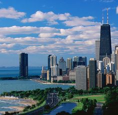 an aerial view of a large city next to the ocean