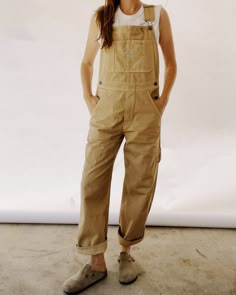 Our Unisex fit in a 100% Cotton Herringbone Twill, enzyme rinsed for a really nice feel. These are a looser and roomier fit which are based off of our favorite vintage pair of overalls! These include lots of little details including green accent stitching, a carpenter loop + pocket, and triple needle stitch seams. They are designed to fit oversized. You can size down for a more fitted look if preferred. 00 / XXS (jean size 24-25) | 0 / XS (jean size 26-27) | 1 / S (Jean size 28-29) | 2 / M (jean Carhartt Overalls Women Outfit, Tan Overalls Outfit, Carhartt Overalls Women, Mission Trip Outfits, Nye 2024, Overalls Outfits, Oversize Outfit, Carhartt Overalls, Farm Clothes