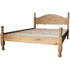 a wooden bed frame with white sheets and wood posts on the headboard, against a white background