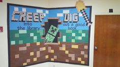 a bulletin board with an image of a minecraft creeper in the library and out a good book