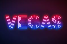 the word vegas is lit up in red and blue neon letters on a dark background