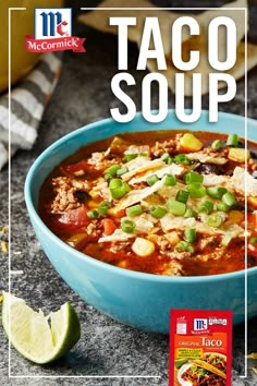 a blue bowl filled with taco soup on top of a table