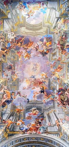 an ornate ceiling with many paintings on it