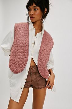 Add a sweet layer to any look with this lightweight quilted vest, featuring daisy motifs all over for a darling detail. **Fit:** Relaxed **Features:** Lightweight cotton blend, open-front style, floral quilting, round hem **Why We | Bali Folk Daisy Vest Jacket at Free People in Pink, Size: M Sleeveless Embroidered Spring Vest, Embroidered Folk Vest For Spring, Folk Style Cotton Vest With Floral Embroidery, Spring Patchwork Cotton Vest, Floral Quilted Vest, Quilted Vest Outfit, Free People Vest, Patchwork Vest, Open Front Vest