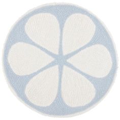 a blue and white circular rug with four petals