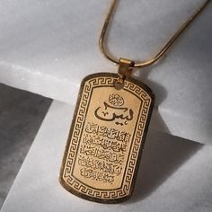 MEANING: YASEEN is the 36th Chapter in the Holy Quran Stainless Steel Pendant (Gold-Filled) Pendant Measures 1.25" L and .75" W Stainless Steel Chain Measuring 18" or 20" Available in Gold or Silver CHAINS IN PHOTO FROM LEFT TO RIGHT ARE SIMPLE, ROPE, AND ROLO DISCLAIMER: Please refrain from wearing this necklace in the restroom, click here for further explanation. Gold Necklace Simple, God Images, Gold Rope Chains, Silver Chains, Holy Quran, Stainless Steel Pendant, Pendant Gold, Rolo Chain, Rope Chain