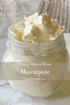 a jar filled with mascarpone sitting on top of a table