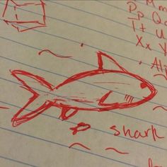 a piece of paper with writing on it and a drawing of a fish in red ink