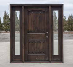 the front door is made of wood and has metal studs on it's sides