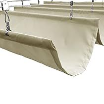 three beige curtains hanging from the side of a window