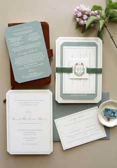 the wedding stationery is laid out on the table