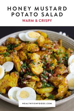 a bowl filled with fried potatoes and boiled eggs