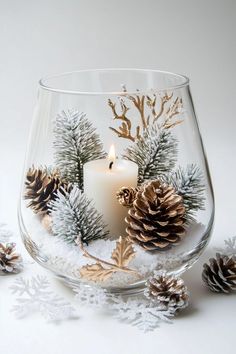 30 Best Christmas Centerpieces To Recreate This Holiday Season Centerpiece Winter Wonderland, Christmas Glass Centerpieces, Christmas Decor Living Room Table, Xmas Vase Ideas, Christmas Decor Ideas Using Glass Vases, Diy Pinecone Christmas Decor, Winter Terrarium Ideas, Christmas Decor Lanterns, Christmas Cocktail Table Centerpiece