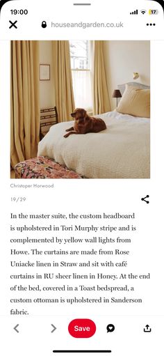 a dog laying on top of a bed in a bedroom