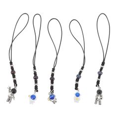 three different necklaces with beads and charms on each one side, all hanging from the same cord