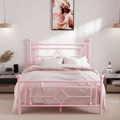 a pink bed with white sheets and pillows