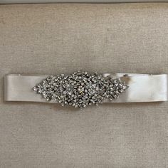 Tara Keely Wedding Dress Belt. Beautiful Crystal And Pearl Medallion Detail. Worn Once, Minor Stationing On Satin Belt But, I’m Sure They Can Be Removed. Preserved In Shadow Box Since Wedding With Pins So There Maybe Minor Pin Punctures. Please Message With Any Questions. Retail Cost: $495 Fitted Beaded Bridal Belt For Wedding, Embellished Fitted Bridal Belt, Tara Keely Wedding Dress, Crystal Embellished Bridal Belt, Embellished Crystal Bridal Belt, Fitted Crystal Embellished Bridal Belt, Marc Jacobs Sunglasses, Satin Belt, Wedding Dress Belt