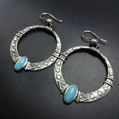 "NAVAJO EARRINGS DESCRIPTION: Heavy cast hoops of sterling silver adorned with oval cabs of turquoise, these earrings will be a cherished addition to your collection of quality Native American jewelry. MEASUREMENTS: 3\" (including wires) x 1 7/8\" WEIGHT: 23.0 grams SIGNED: AW, for Annalise Williams (Navajo) STERLING: yes, stamped STERLING" Vintage Earring, Turquoise Hoop Earrings, Engagement Earrings, Earrings Handmade Dangle, Big Hoop Earrings, Earrings Metal, Jewelry Style, Party Earrings, Earring Type