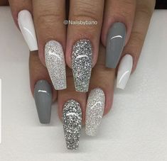 a manicure with silver and white glitters on the tip of each nail is shown