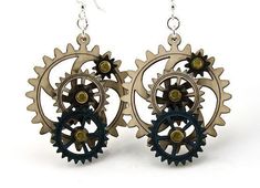 Are you a gear-head? Have a hard time matching your jewelry to your gold goggles? No need to ruffle your bustle! These interconnected gears will keep you on track. The best part? All gears move! These intricate wood earrings are laser-cut for precision, dyed aquamarine and black satin surrounded Steampunk Diy Crafts, Gear Earrings, Gear 3, 3 Earrings, Dangle Belly Rings, Satin Noir, Giddy Up Glamour, Jewelry Tree, Hippie Jewelry