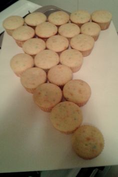 several cupcakes are arranged in the shape of an arrow