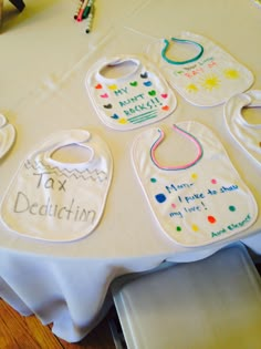 a table with bibs on it that say tax deduction